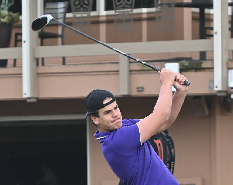 Sequim's Pryce Glasser tees off on the first hole in an April 21 match against Bainbridge. Sequim Gazette photo by Michael Dashiell