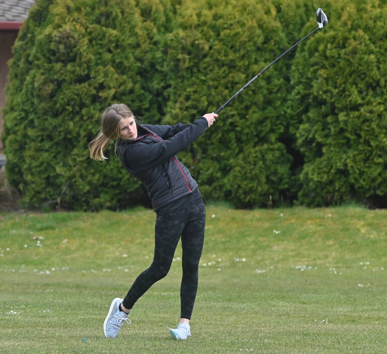 Sequim's Hanna Wagner tees off on the first hole in an April 21 match against Bainbridge. Sequim Gazette photo by Michael Dashiell
