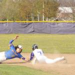 Sequims Connor Bear slides in just before the tag at second base as the Wolves take on Bremerton on April 19 at home. Trying to make the tag for the Knights is Brian Infante. Sequim Gazette photo by Michael Dashiell
