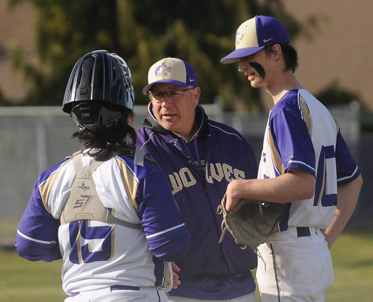 Sequim coach Dave Ditlefsen talks with catcher Ayden Holland and pitcher Zac McCracken in the third inning of an Olympic League match-up with Bremerton on April 19. Sequim Gazette photo by Michael Dashiell