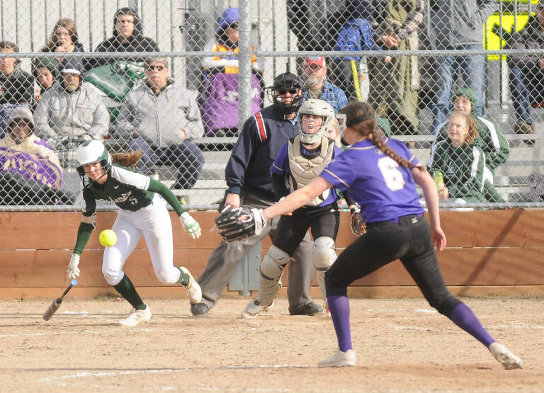 Sequim Gazette photos by Michael Dashiell
Port Angeles Zoe Smithson looks for a hit as Sequim catcher Christy Grubb and pitcher Angel Wagner defend the play in PAs 14-7 win in Sequim on April 19.