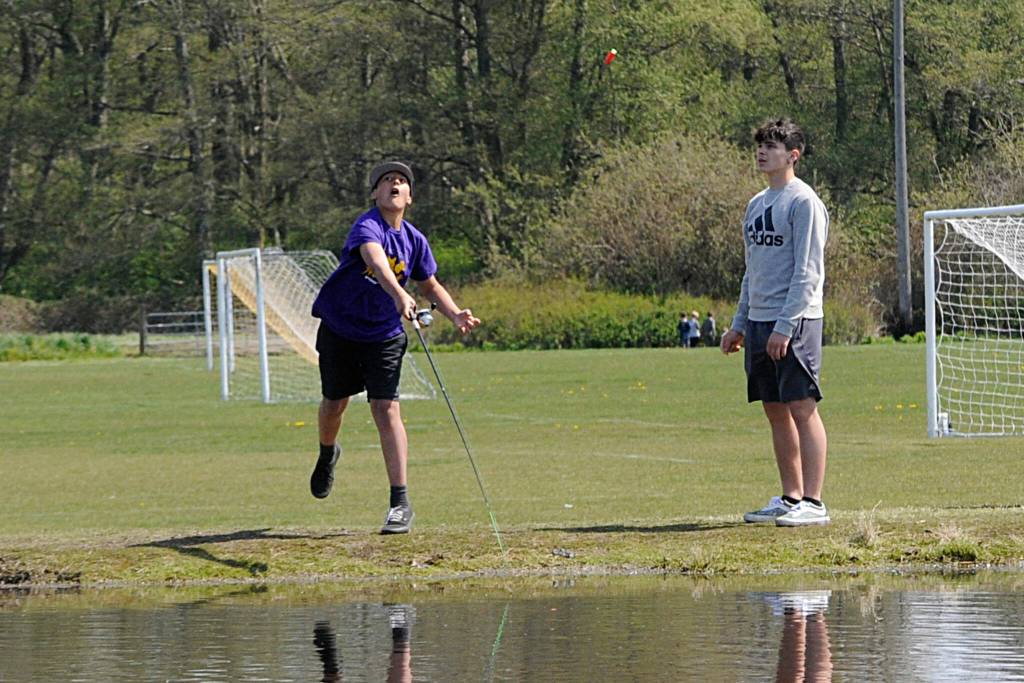 Sequim Gazette photo by Matthew Nash
Jonis Alokoa, 13, of Sequim casts out during Kids Fishing Day on April 23 as AJ Martinez, 16, of Port Angeles watches.