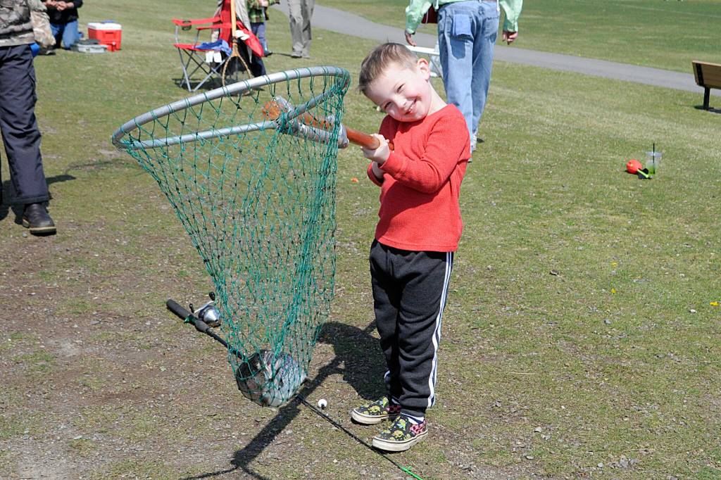 Sequim Gazette photo by Matthew Nash
Bentley Wopperer, 4, of Port Angeles shows off his catch during the Kids Fishing Day event. His dad Terry Wopperer said it was Bentleys first catch ever.