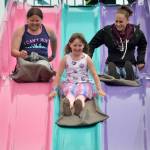 Sequim Gazette file photo by Matthew Nash
Sisters Angel and Savannah Wagner race their mom Natalie Topham at the Sequim Irrigation Festivals carnival in 2019.