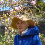 Laurel Ann Norman pauses under her magnolia tree after sharing about the days, beginning in the 1990's, when she and her husband Robert Norman were farmers on the five acres that later became Chi's Farm. Back then the land was host to "Laurel Ann's Rainbow Farm" and horticulturist Paul Moore's "Grandpa's Iris Garden." Sequim Gazette photo by Emily Matthiessen