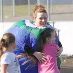 Assistant principal Sarah Decker gets a hug from first-grader Ava Korwel at Helen Haller Elementary's School's annual Fun Run, held on Earth Day (April 22). Sequim Gazette photo by Michael Dashiell