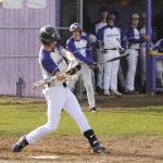 Sequims Zac McCracken tees up a pitch for a hit in the Wolves 5-1 win over North Mason on April 25. Sequim Gazette photo by Michael Dashiell