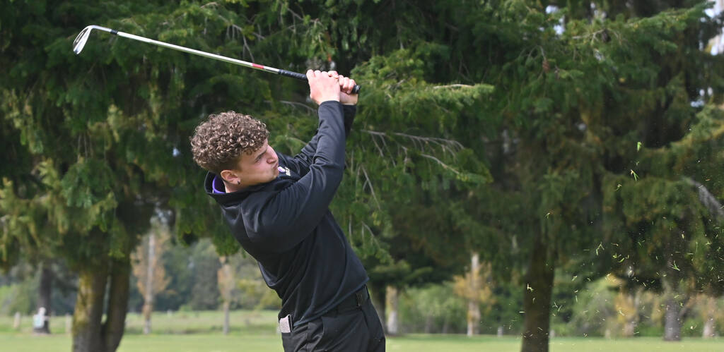Sequims Dominic Riccobene tees off on the 11th hole as the Wolves take on North Kitsap on April 28. Sequim Gazette photo by Michael Dashiell
