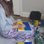 Photo courtesy of Kyle Johnson
Sequim preteen Josephine Johnson works on a painting that shell sell to raise funds for Ukrainian refugees through UNICEF.