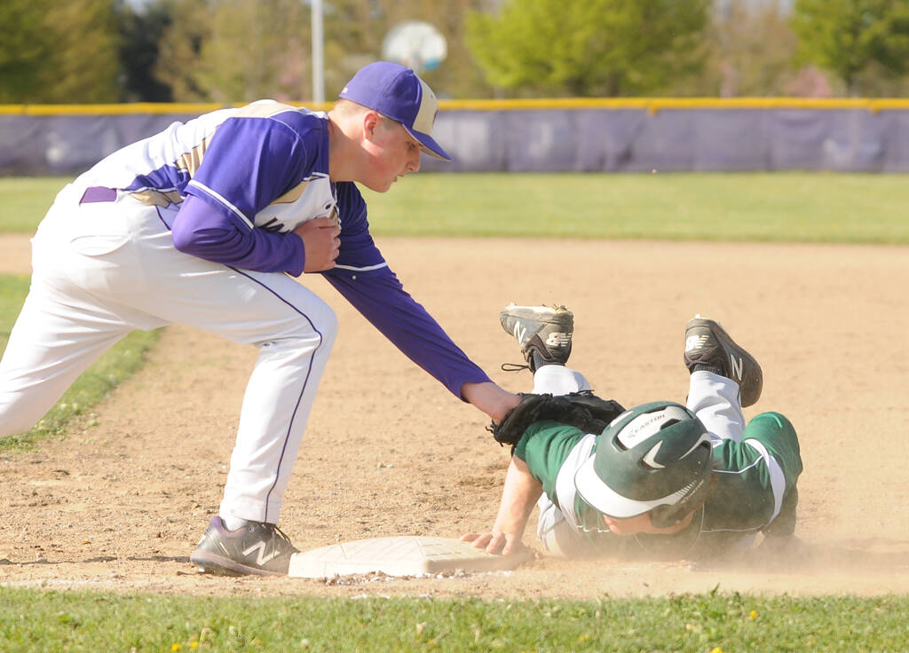 Michael Dashiell/Sequim Gazette
Sequim first baseman Braiden White puts a tag on Port Angeles Beckett Jarnigan in an Olympic League game on May 2.