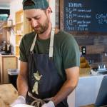David Rivers, co-manager, serves a hot bowl of ramen at Soup in the Alley, where diners can pay what they can afford for lunch Monday through Friday Sequim Gazette photo by Emily Matthiessen