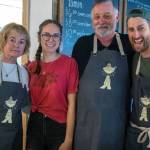 From left Katie Amundson, Anna Potter, Carl Amundson and David Rivers serve at Soup in the Alley, a ministry of Calvary Chapel in Sequim at 138 W. Washington St., open Monday through Friday 11 a.m.-2 p.m., serving chicken stock based ramen with meat, egg and vegetable toppings to all comers, regardless of financial situation. Sequim Gazette photo by Emily Matthiessen