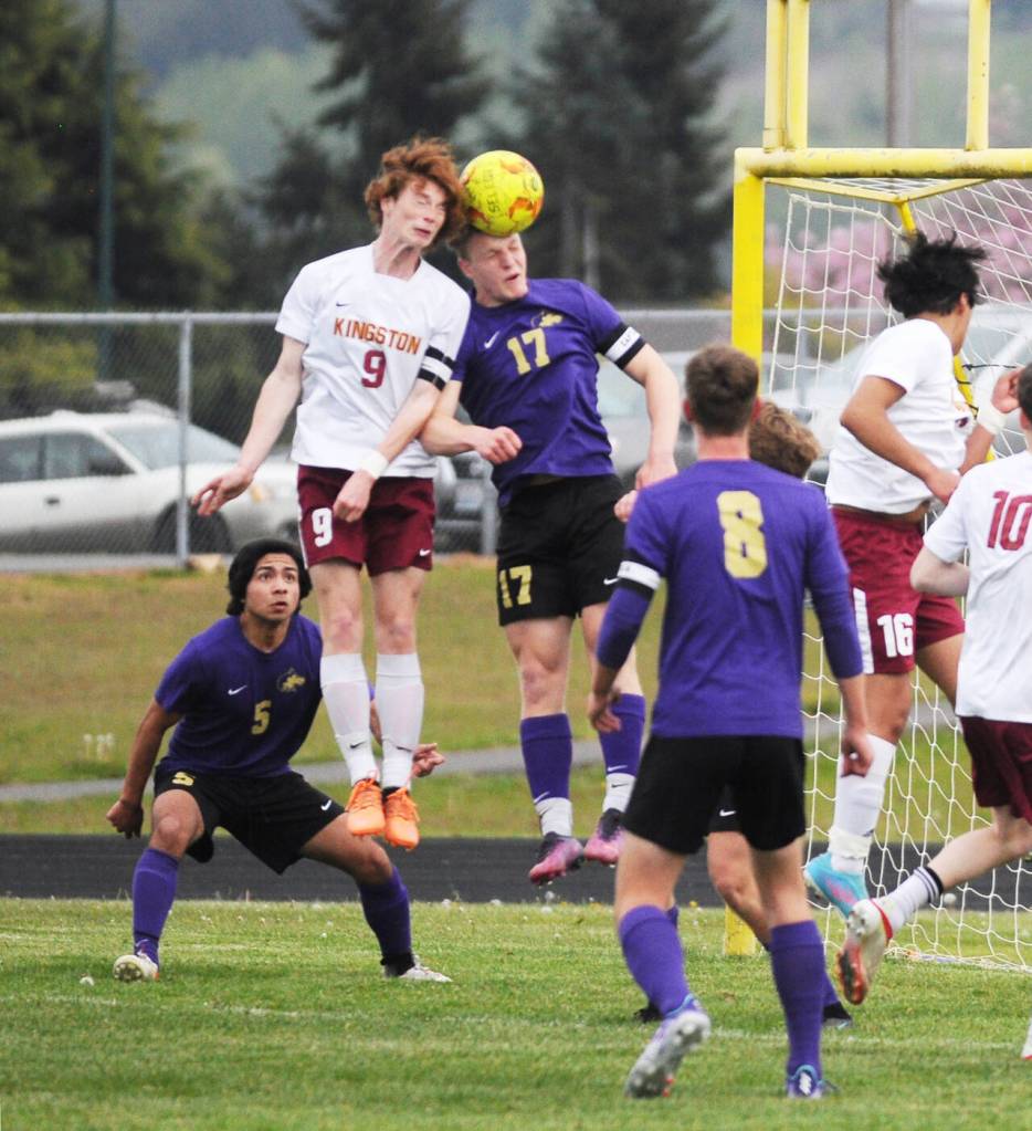 Michael Dashiell/Sequim Gazette
Sequims Aidan Henninger (11) and Kingstons Marshall Kilpatrick battle for the ball in the first half of Sequims 4-0 Senior Night victory.