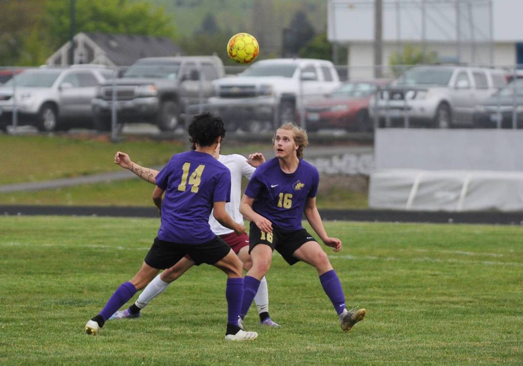 Sequim seniors Harrison Bell (16) and Javier Gomez keep track of a ball in Wolves territory, in Sequims 4-0 win over Kingston May 4. Sequim honored 11 seniors in their final home match. Sequim Gazette photo by Michael Dashiell