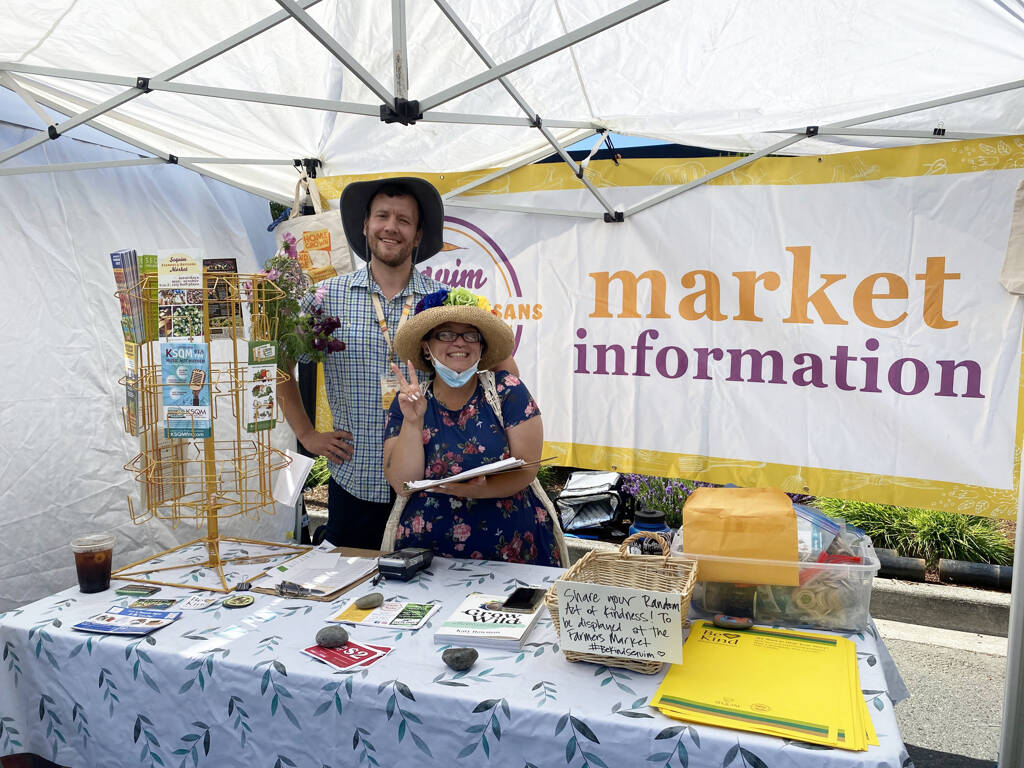 Emma Jane Garcia/Sequim Farmers Artisans Market
Tim Acree and Rachel Anderson greet visitors at the Sequim Farmers & Artisans Market information booth.