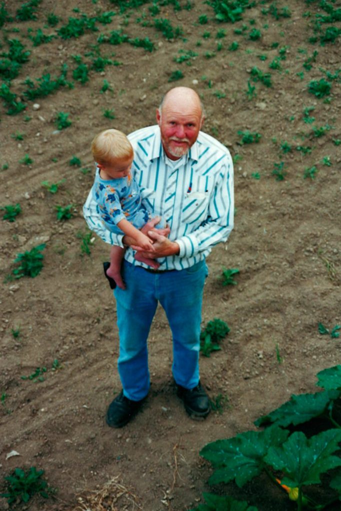 Photo courtesy of the Schmidt Family/ Roger Schmidt shows his grandson Chandler the Sequim Pumpkin Patch.