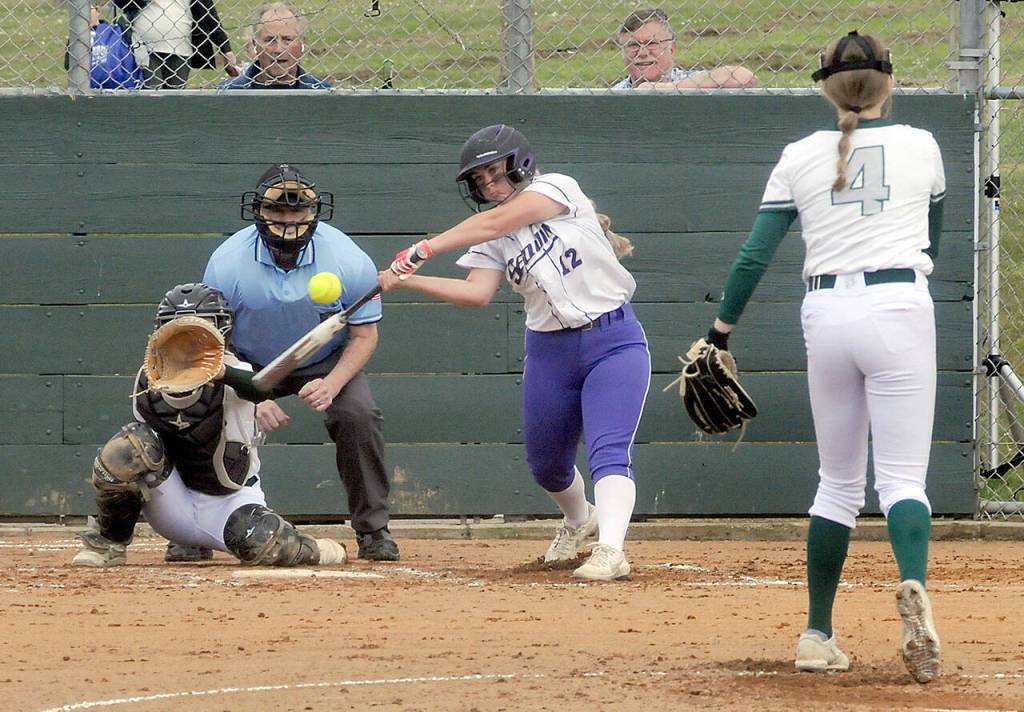 Photo by Keith Thorpe/Olympic Peninsula News Group 
Sequims Michaela Green swings at a pitch from Port Angeles Teagan Clark as catcher Zoe Smithson waits for the delivery on May 12 in Port Angeles.
