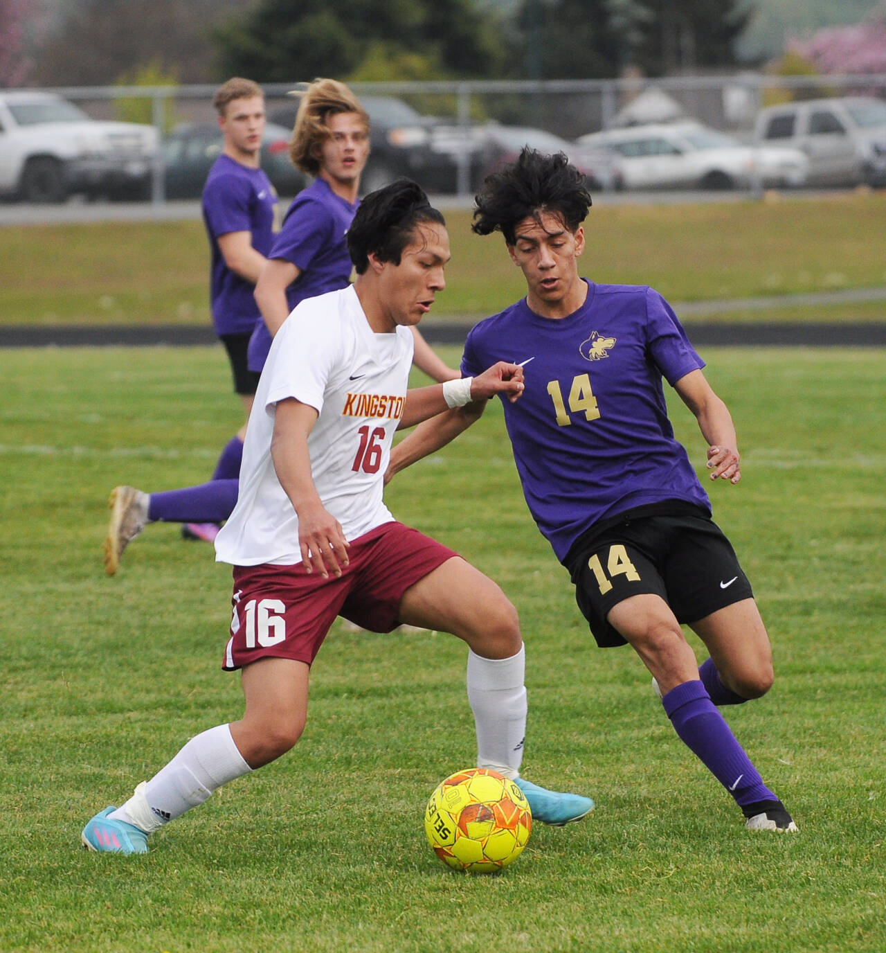 Sequims Javier Gomez, right, vies for the ball with Kingstons Anglas Alvaro in an Olympic League match-up on May 4. Gomez scored the winning goal in the second overtime in the Wolves opening West Central District game against Franklin Pierce on May 10, ensuring a state 2A tournament berth. Sequim Gazette file photo by Michael Dashiell