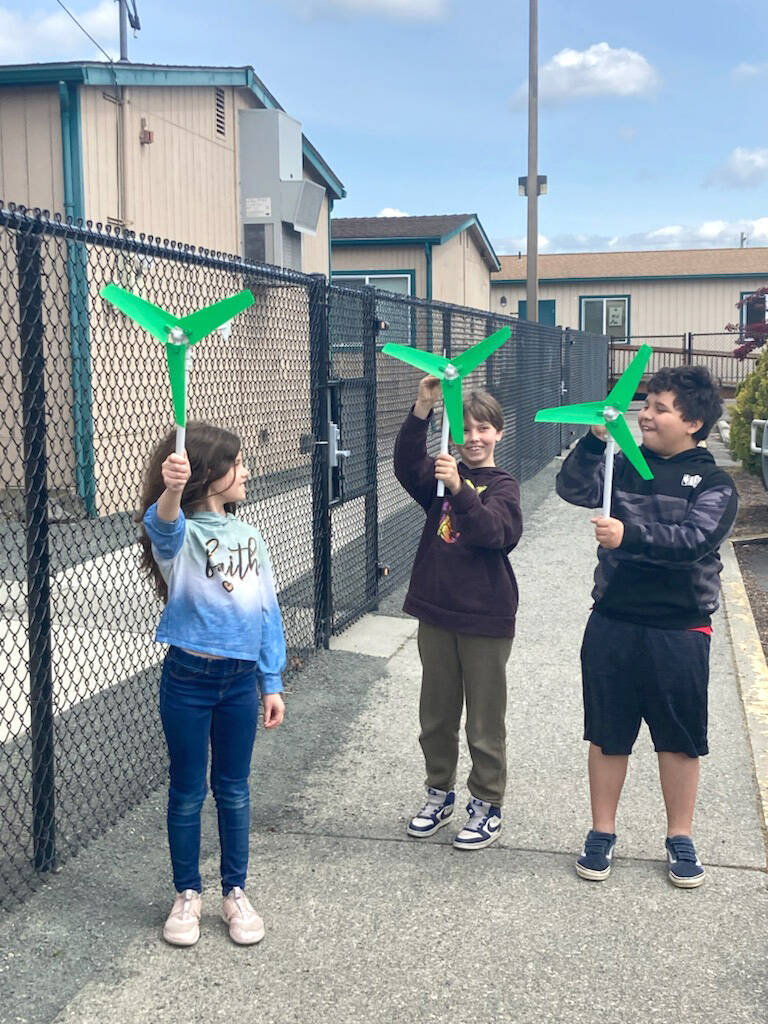 Submitted photo
From left, Natalie Tripp, Christian Furnish and Manuel Yanez, students at Helen Haller Emenrtary, test wind turbines.
