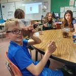 Submitted photo
From left, students Dalton Wilkinson, Ellie Roedell and Selene Dorkin make layers of soil in a recent lesson at Helen Haller Elementary School.