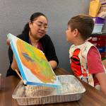 Submitted photo
Helen Haller Elementary student Liam Johnson paints with his mom during a recent project at Helen Haller Elementary School.