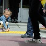 Sequim Gazette photo by Matthew Nash
Lilee Perez, 5, grabs candy as the Sequim FFA walks by in the Sequim Irrigation Festival Grand Parade. Lilees grandma said they came to watch her older brother in the band.