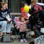 Sequim Gazette photo by Matthew Nash/ Nineteen-month-old Ember Meier receives a balloon on Saturday during the Grand Parade.