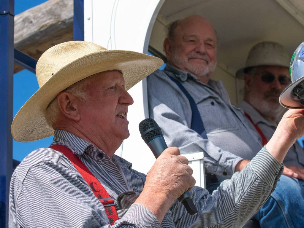 Dave Bekkevar, pictured at left emceeing the Sequim Irrigation Festival Logging Show on May 14, celebrates the shows 2022 Honorary Logger, Del Gott. In 1987, Gott started Diamond Construction in Sequim and it is still going strong to this day, festival organizers note. Sequim Gazette photo by Emily Matthiessen