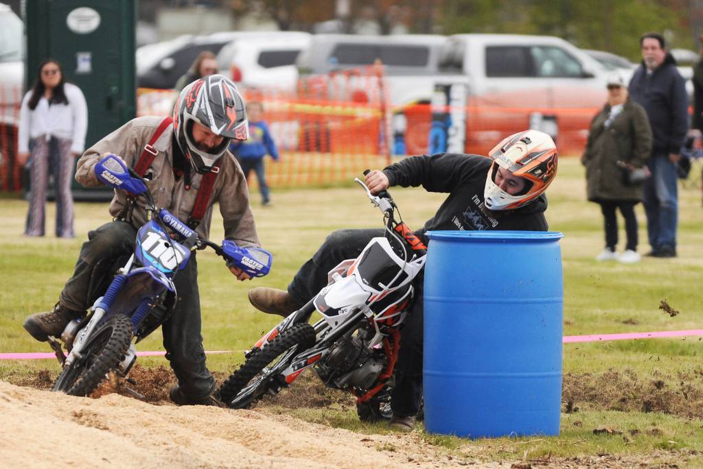 Mini bike racers Ole Bekkevar, left, and Jeff Secord vie for a top finish at the Sequim Irrigation Festival Logging Show on May 13.