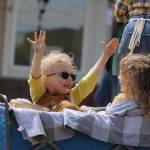 The Thompson twins  Hazel and Jude  enjoy Saturdays Grand Parade in style as part of the Sequim Farmers & Artisans Market entry. Sequim Gazette photo by Michael Dashiell