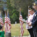 Nancy Zimmermann, chaplain for American Legion Post 62, offers a prayer at the Memorial Day ceremony at Sequim View Cemetery in 2021. At right is Post commander Paul Renick. Sequim Gazette file photo by Michael Dashiell