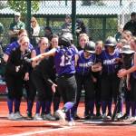 Photo by Kevin Hanson/Enumclaw Courier-Herald 
Sequim teammates celebrate Taylee Romes home run over the left field fence in the Wolves 21-1 rout of Sammamish on May 20, a win that secured Sequim a berth in the state 2A tournament.