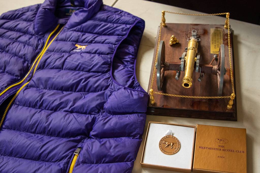 Sequim Gazette photo by Emily Matthiessen / Officials at Westminster Kennel Club sent Chris Cornells son Shahn the judging jacket and commemorative judging token they had intended to award Cornell upon his judging the Obedience Trials for the club this June 20. They are seen here beside one of the Civil War pewter pieces Cornell collected. Shahn said that he has received many pieces of mail from people from across the USA, detailing the kindness he showed them.