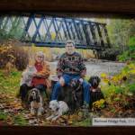 Claire and Chris Cornell pose with adopted and foster dogs at the Railroad Bridge Park in Sequim in 2012. Chris, a photographer as well as a highly-respected dog obedience trial judge, passed away suddenly early this June on the cusp of judging obedience at the Westminster Kennel Club Show in New York. Claire passed away last April and Bree, their black flat-coated retriever, passed away early this year. Submitted photo