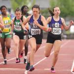 Sequim Gazette photos by Michael Dashiell 
Sequims Eve Mavy (2589) takes a handoff from teammate Kaitlyn Bloomenrader in the third leg of the Wolves state 2A title-winning 4x400 relay on May 28. Sequim edged Lynden by 0.09 of a second.