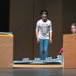 Rivers Maynard, Madelynn McIntyre, Sophia Mason and Brooklynn Glavin grapple with repairing the castle in Dragon Trouble, a play performed by 20 1st-5th graders from Olympic Peninsula Academy on June 3 and 4 at Sequim High School auditorium. Sequim Gazette photo by Emily Matthiessen