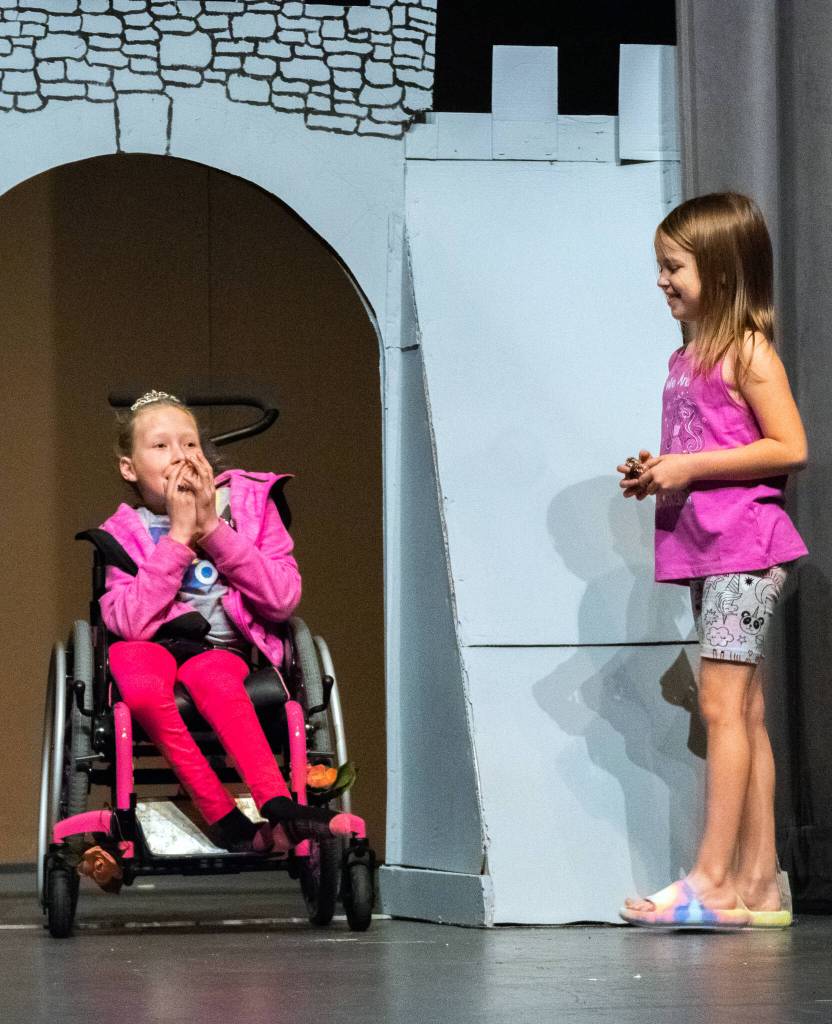 Sequim Gazette photo by Emily Matthiessen
Princess Sopia Mason and dragon Bekah Abken interact in Dragon Trouble, a play the 1st-5th graders of Olympic Peninsula Academy are preparing to share with the public on June 3 and 4.