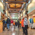 Sequim Gazette photoS by Emily Matthiessen
Above: Community members and dignitaries explore the newly-refurbished and expanded Dungeness River Nature Center Sunday afternoon. Upper left: Annette Hanson helps the community celebrate the opening of the center, which got its start four decades ago when her late husband started a museum at the old Sequim High School building on North Sequim Avenue for students. Lower left: W. Ron Allen, tribal chairman for the Jamestown SKlallam Tribe, cuts a wreath to celebrate the opening of the Nature Center.