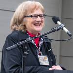 Sequim Gazette photo by Emily Matthiessen/ Annette Hanson helps the community celebrate the opening of the Dungeness River Nature Center Sunday afternoon. The center got its start four decades ago when her late husband started a museum at the old Sequim High School building on North Sequim Avenue for students.
