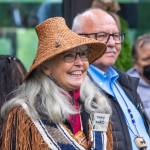 Sequim Gazette photo by Emily Matthiessen / Dana Ward smiles as she is introduced to the small crowd gathered to commemorate the opening of the Dungeness River Nature Center on Sunday. Ron Allen stands beside her.