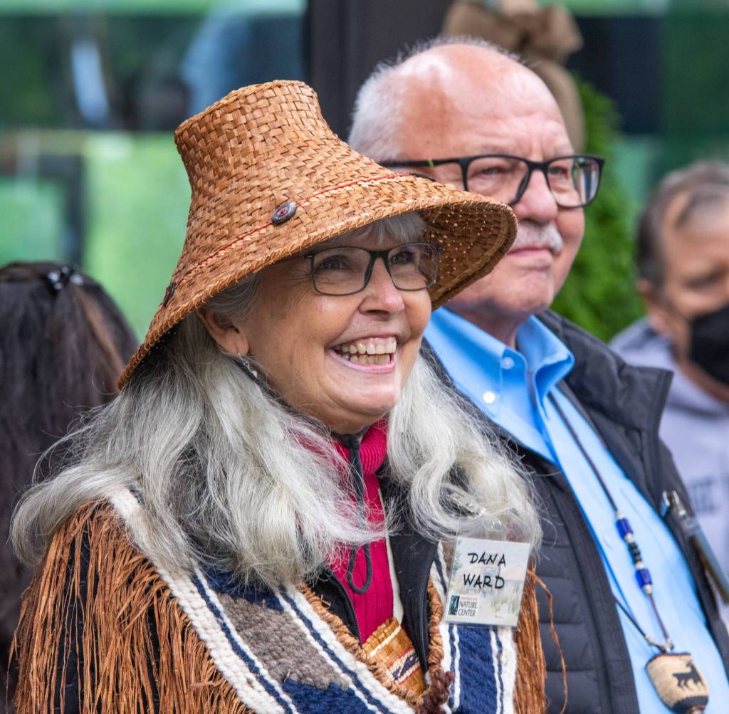 Sequim Gazette photo by Emily Matthiessen / Dana Ward smiles as she is introduced to the small crowd gathered to commemorate the opening of the Dungeness River Nature Center on Sunday. Ron Allen stands beside her.