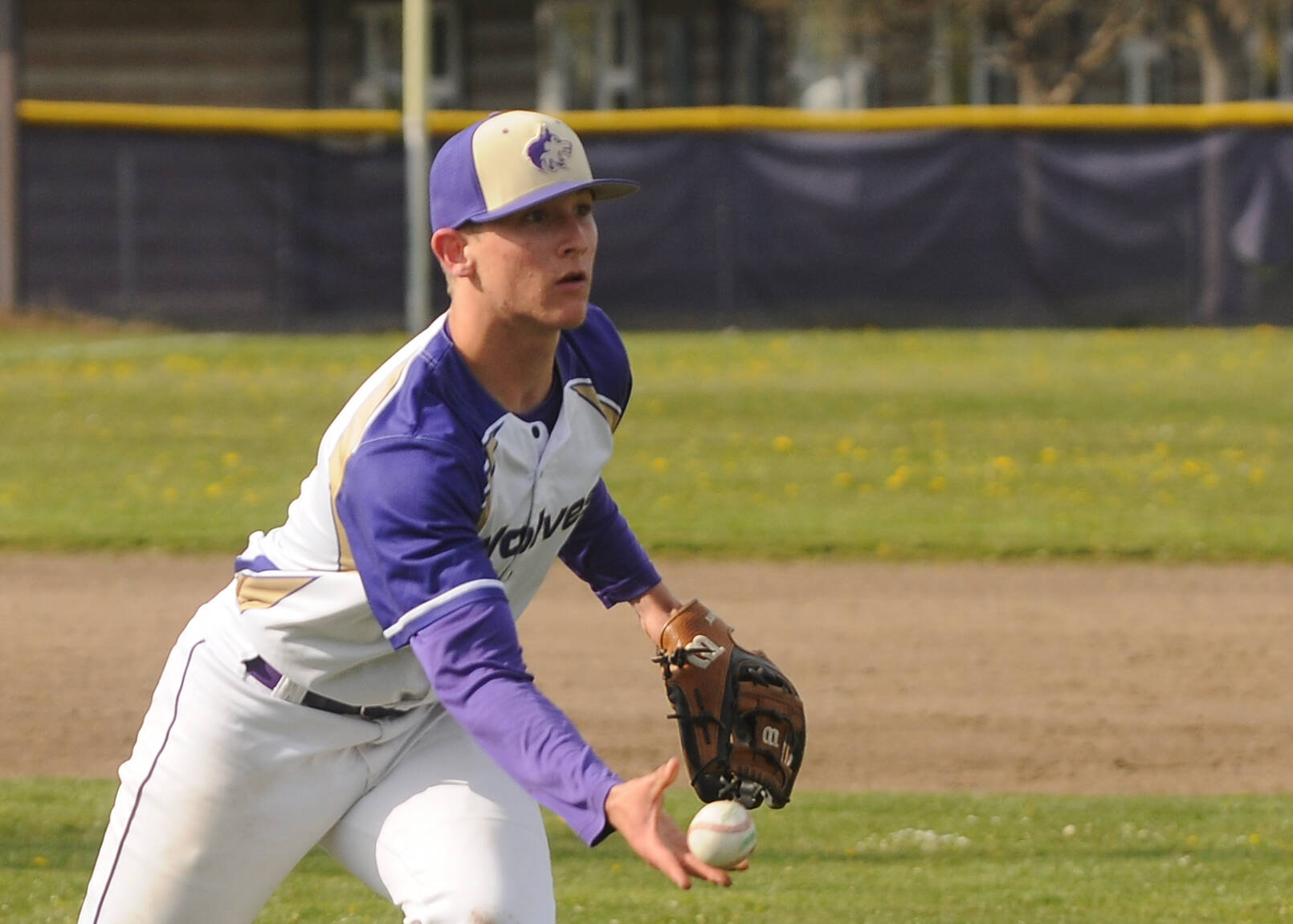 Sequim Gazette photo by Michael Dashiell
Sequim pitcher Connor Bear fields a grounder and throws out a North Mason batter in the Wolves 5-1 win on April 28. Bear threw five shutout innings in the Wolves 5-1 win.