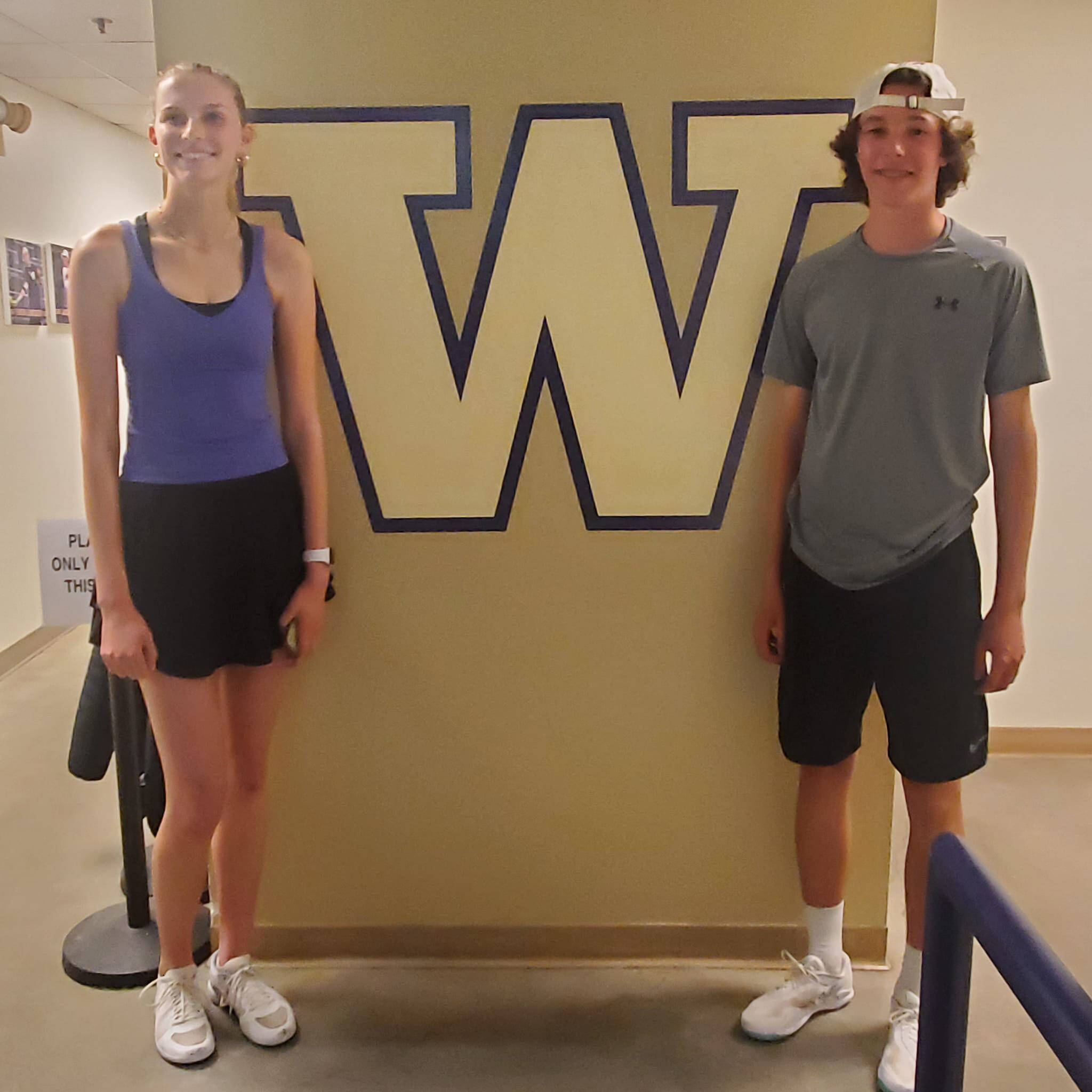 Sequim Highs Kendall Hastings and Garrett Little take a break from play at the state 2A tennis tournament in Seattle in late May. Little, a sophomore, placed third and Hastings, a junior, took eighth, both in singles play. Photo by Allison Hastings