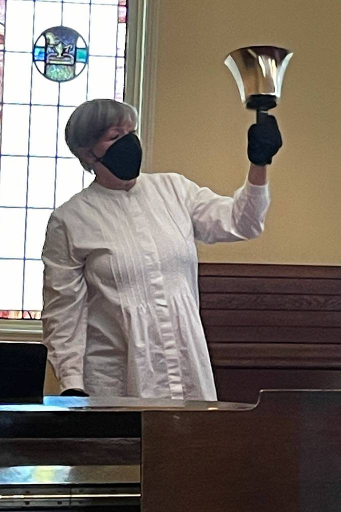During a special service on May 27. Rev. ClayOla Gitane with St. Lukes Episcopal Church rings a bell after each name is read of a victim in the Robb Elementary School shooting in Uvalde, Texas.