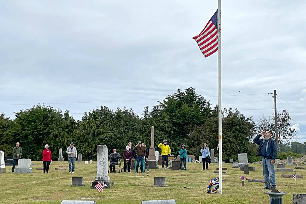 Sequim Gazette photo by Matthew Nash
Phil Capogna, acting sergeant in arms for American Legion Post 62, leads a salute to the flag to honor veterans in the Dungeness Cemetery on Memorial Day.