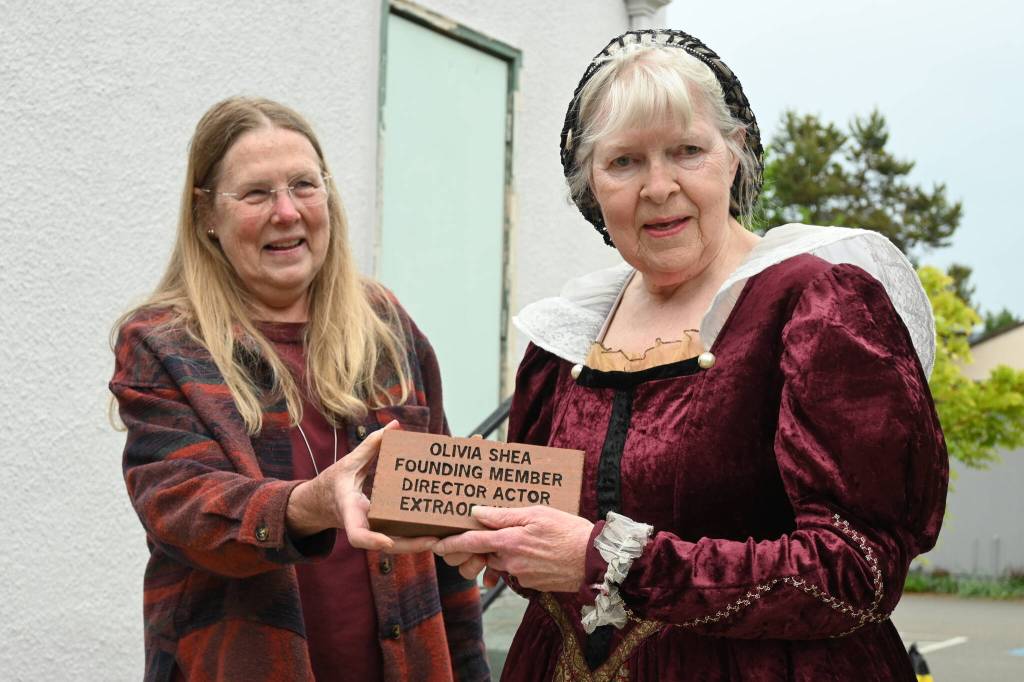 Sequim Gazette photo by Michael Dashiell 
Olivia Shea, right receives a special brick engraved in her honor at the Olympic Theatre Arts from OTA executive director Carol Willis on June 1.