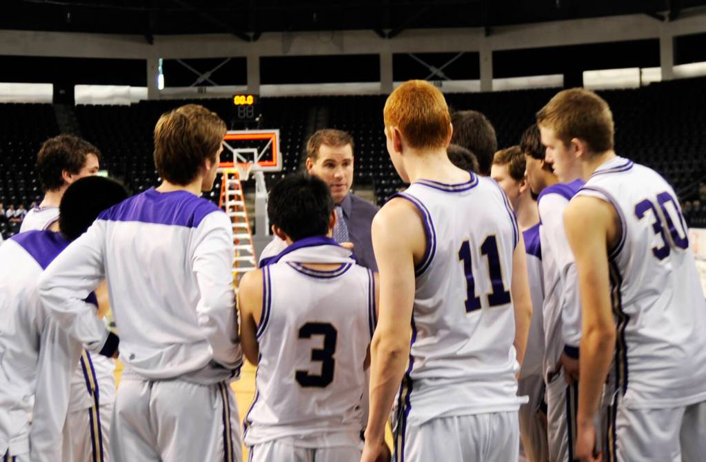 Greg Glasser talks with his team following the West Central District championship game against Clover Park in 2013. Sequim gazette file photo by Michael Dashiell