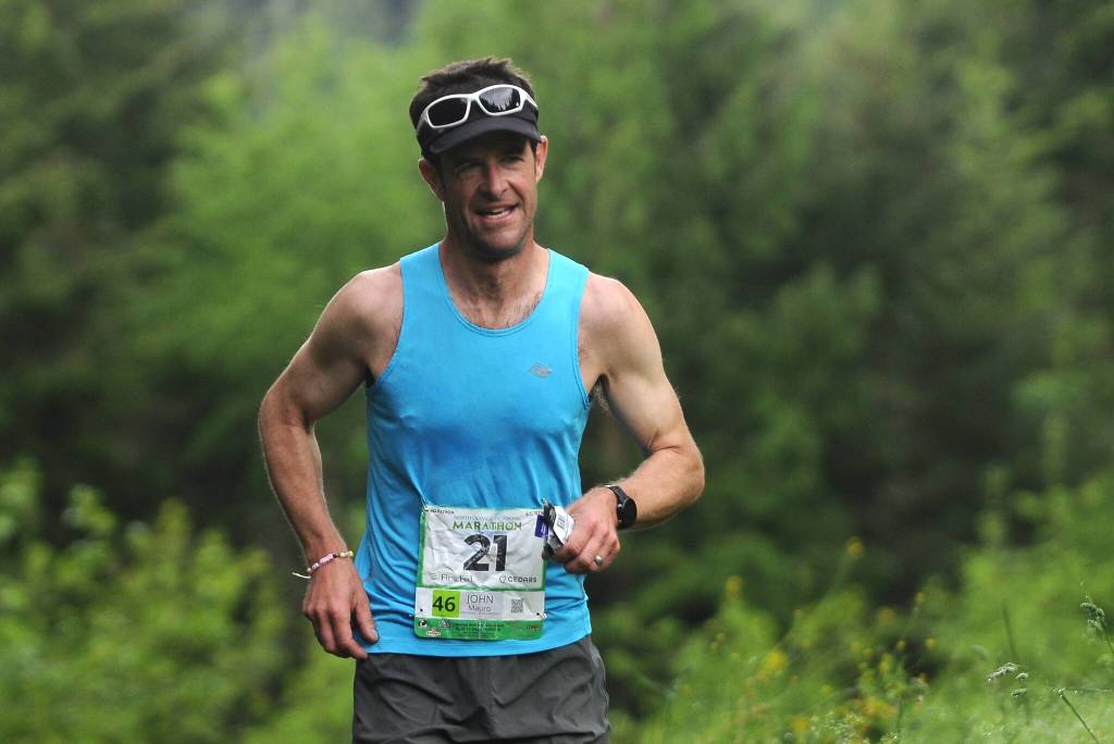 Port Townsend runner John Mauro climbs a small hill near Whitefeather Way en route to a win in the 2022 North Olympic Discovery Marathon; he finished in 3:00.47. Sequim Gazette photo by Michael Dashiell