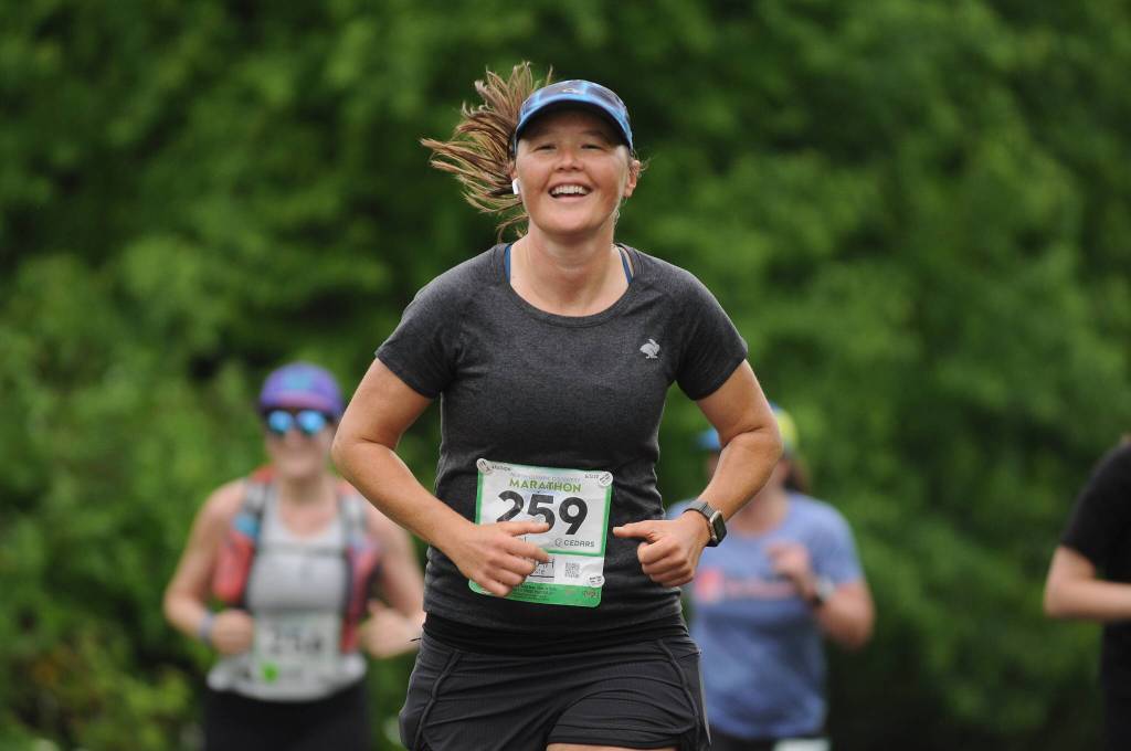 Sarah Batiste of Chico, Calif., grins as she races in Sundays North Olympic Discovery Marathon. Sequim Gazette photo by Michael Dashiell