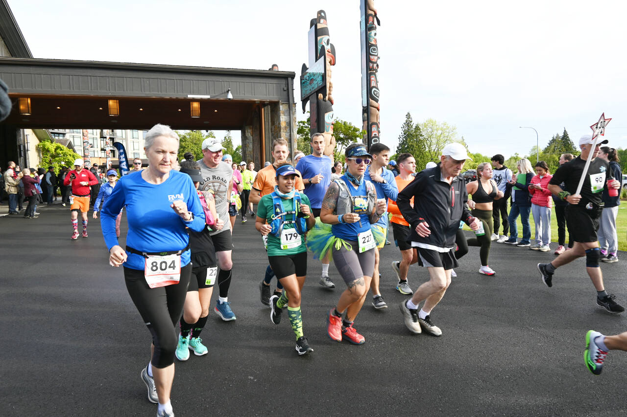 Runners break from the starting line of the 2022 North Olympic Discovery marathon at 7 Cedars Resort in Blyn on June 5. The 20th iteration of the Sequim-to-Port Angeles race was expected to draw 350 full marathoners and 20 relay teams to go along with 900 half marathon participants. Sequim Gazette photo by Michael Dashiell
